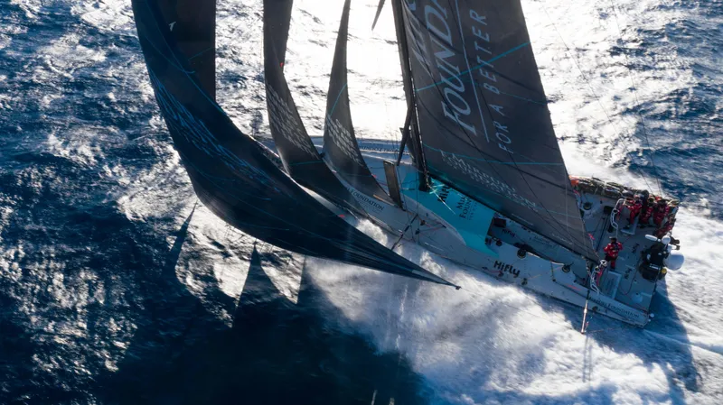  Yacht Photos Pics Sailing yacht Farr Volvo Ocean 65, 2014, cutting through ocean waves at high speed.