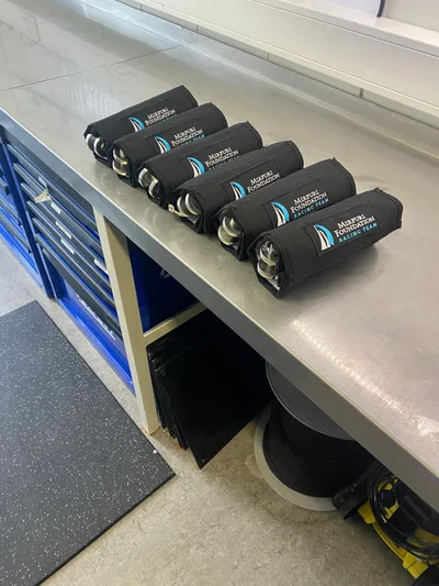  Yacht Photos Pics Six Farr Volvo Ocean 65 branded items on a workshop counter, 2014 model.