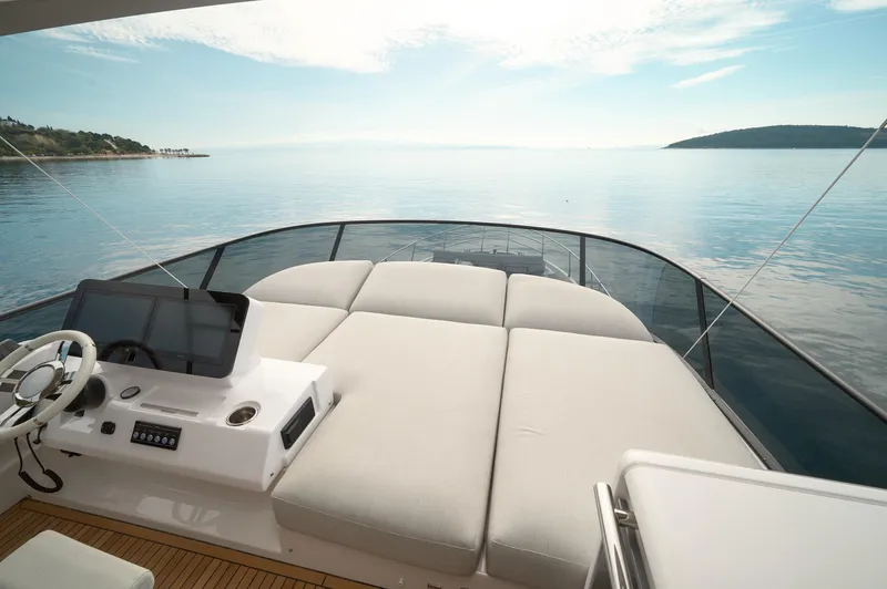 Yacht Photos Pics 2023 Azimut 53 yacht deck with luxurious seating and serene ocean view.