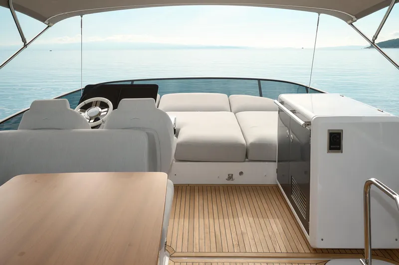  Yacht Photos Pics Luxurious 2023 Azimut 53 yacht interior with elegant seating and ocean view.