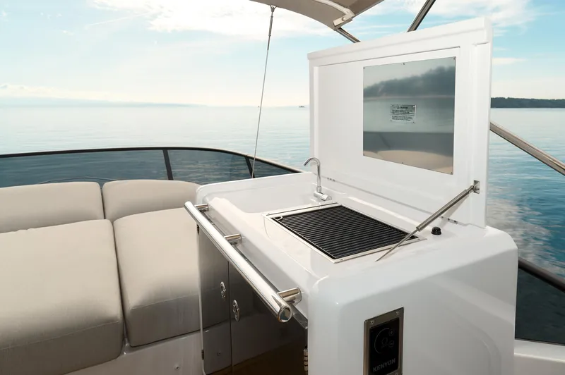  Yacht Photos Pics 2023 Azimut 53 yacht with outdoor kitchen and scenic ocean view.