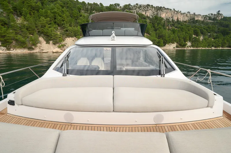  Yacht Photos Pics 2023 Azimut 53 yacht with sleek design, spacious deck, and scenic coastal backdrop.