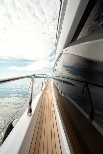  Yacht Photos Pics 2023 Azimut 53 yacht deck with ocean view and cloudy sky.