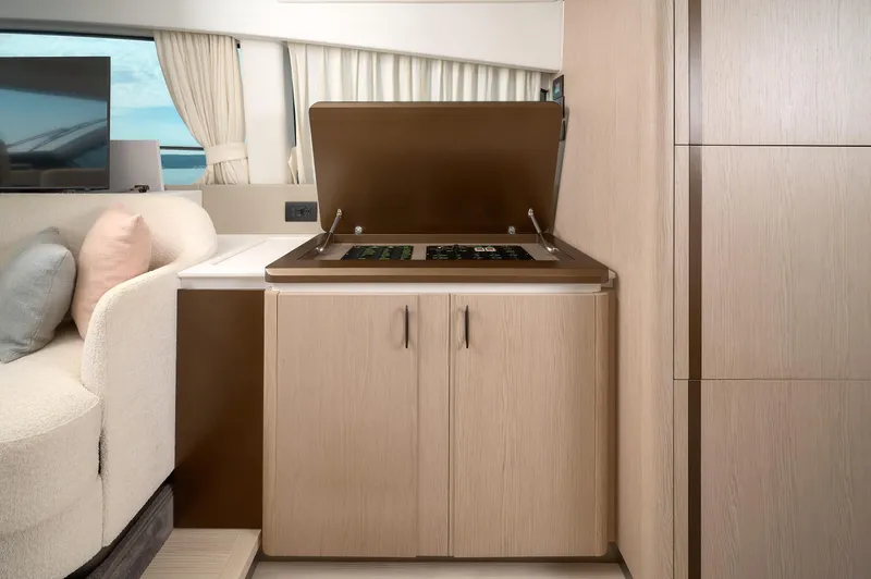  Yacht Photos Pics Modern kitchen area in 2023 Azimut 53 yacht with sleek cabinetry and stove.