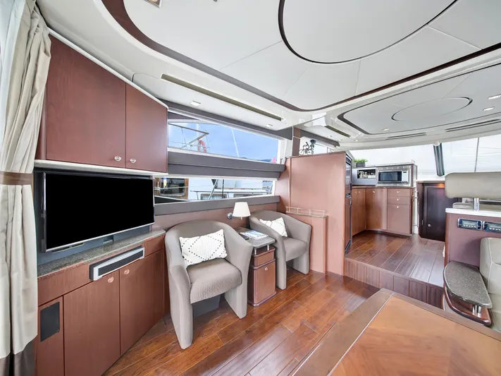 Serenity Yacht Photos Pics Luxurious interior of 2012 Meridian 441 Sedan yacht with modern furnishings and wood finishes.