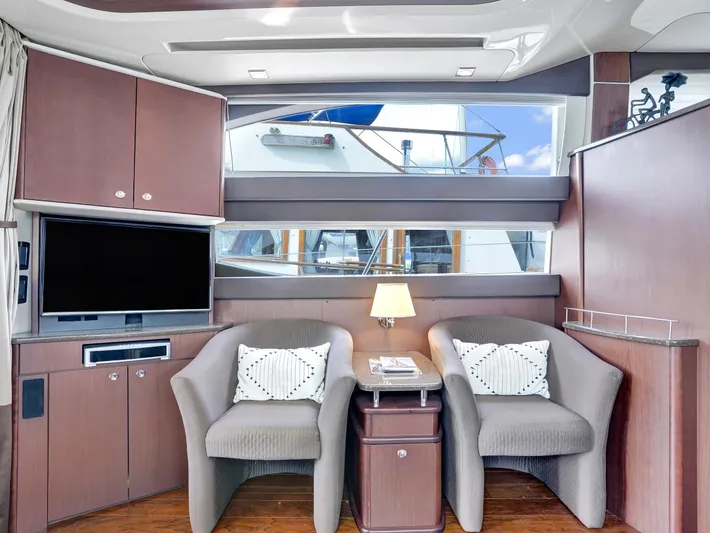 Serenity Yacht Photos Pics Luxurious interior of 2012 Meridian 441 Sedan yacht with cozy seating and modern decor.
