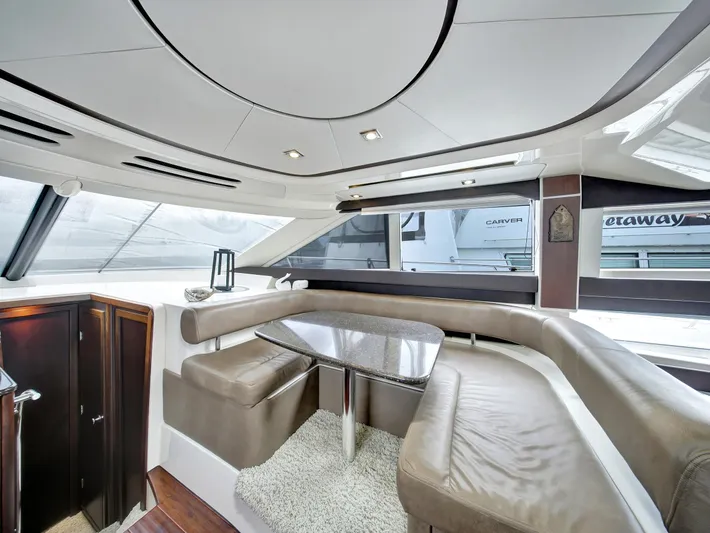 Serenity Yacht Photos Pics Luxurious interior of 2012 Meridian 441 Sedan yacht with elegant seating and modern design.