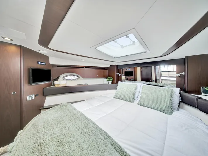 Serenity Yacht Photos Pics Luxurious 2012 Meridian 441 Sedan yacht bedroom with modern decor and skylight.