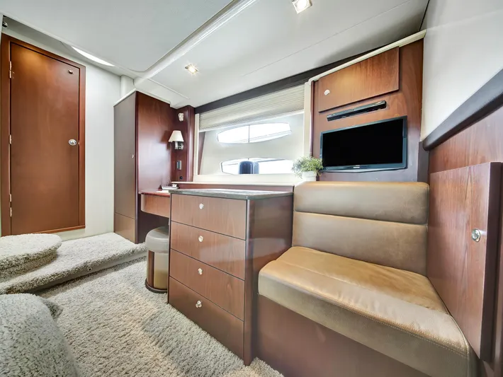 Serenity Yacht Photos Pics Luxurious interior of 2012 Meridian 441 Sedan yacht with elegant wood finishes and cozy seating.