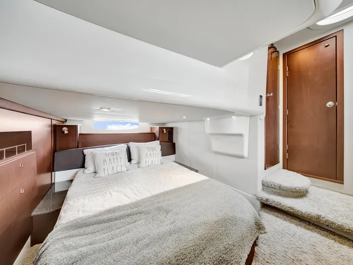 Serenity Yacht Photos Pics Luxurious bedroom interior of 2012 Meridian 441 Sedan yacht with cozy bedding and wooden accents.