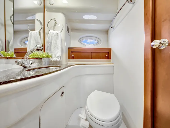 Serenity Yacht Photos Pics Luxurious bathroom in 2012 Meridian 441 Sedan yacht with modern fixtures and elegant design.
