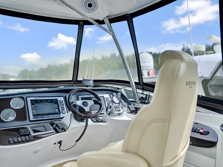 Serenity Yacht Photos Pics Helm of 2012 Meridian 441 Sedan yacht with modern controls and panoramic view.