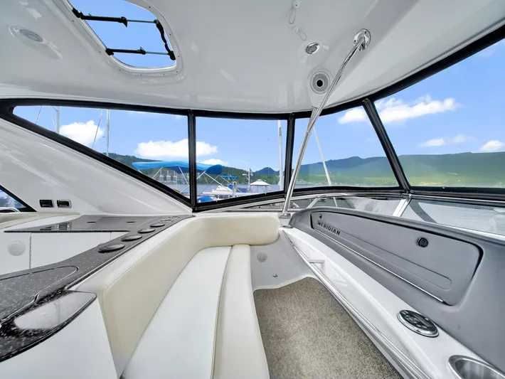 Serenity Yacht Photos Pics Interior of 2012 Meridian 441 Sedan yacht with panoramic windows and luxurious seating.