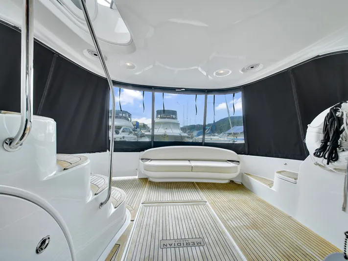 Serenity Yacht Photos Pics Luxurious 2012 Meridian 441 Sedan yacht interior with seating and panoramic windows.