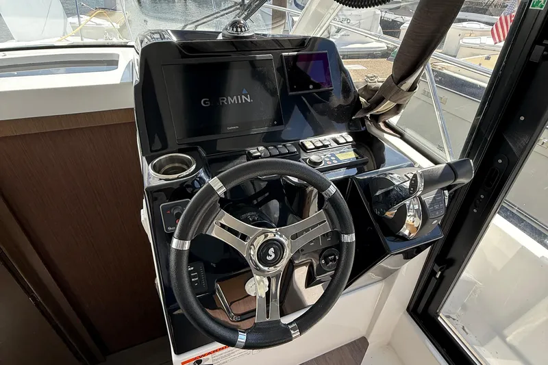  Yacht Photos Pics Helm of 2021 Beneteau Antares 9 with Garmin navigation system.