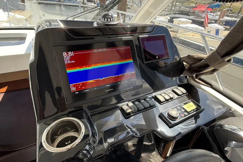  Yacht Photos Pics Control panel of 2021 Beneteau Antares 9 with Garmin navigation system.