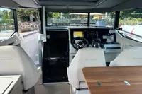 Interior of 2022 Saxdor 320 GTC boat with modern helm and seating area.