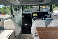 Interior of 2022 Saxdor 320 GTC boat with modern helm and seating.