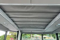 Interior view of 2022 Saxdor 320 GTC boat with a retractable roof.