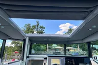Interior view of 2022 Saxdor 320 GTC boat with open roof and modern dashboard.