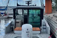 2022 Saxdor 320 GTC boat docked, featuring a powerful 425 V8 engine.