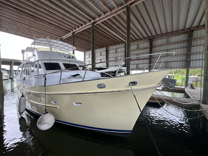 Ranger Yacht Photos Pics 1986 Cheoy Lee 66 Long Range Motor Yacht docked in covered marina.