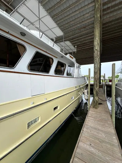Ranger Yacht Photos Pics 1986 Cheoy Lee 66 Long Range Motor Yacht docked under a covered marina.