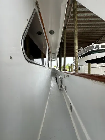 Ranger Yacht Photos Pics 1986 Cheoy Lee 66 Long Range Motor Yacht side deck view under covered dock.