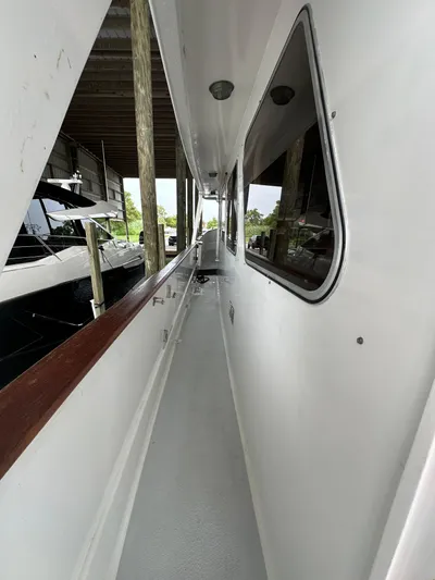 Ranger Yacht Photos Pics Side deck of 1986 Cheoy Lee 66 Long Range Motor Yacht, docked under shelter.