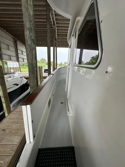 Ranger Yacht Photos Pics 1986 Cheoy Lee 66 Long Range Motor Yacht docked in covered marina.