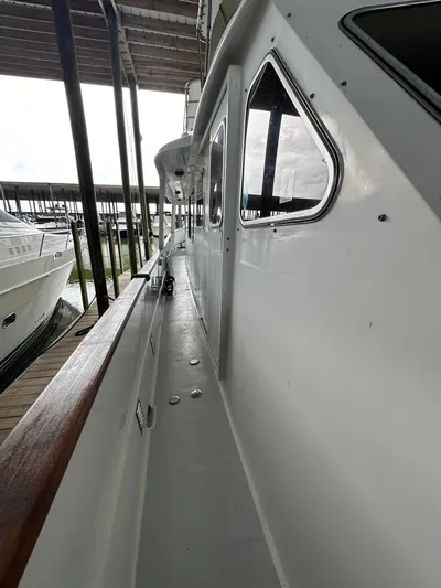 Ranger Yacht Photos Pics 1986 Cheoy Lee 66 Long Range Motor Yacht docked in marina, side view.