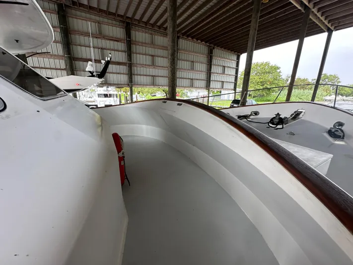 Ranger Yacht Photos Pics 1986 Cheoy Lee 66 Long Range Motor Yacht in covered dock, showcasing deck details.