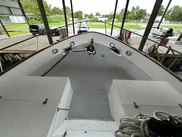 Ranger Yacht Photos Pics 1986 Cheoy Lee 66 Long Range Motor Yacht deck view in a covered dock.