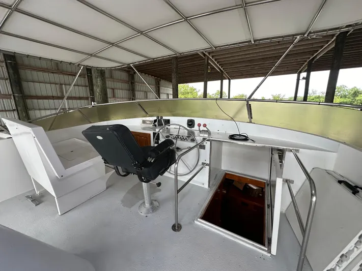 Ranger Yacht Photos Pics 1986 Cheoy Lee 66 Long Range Motor Yacht helm with covered seating area.