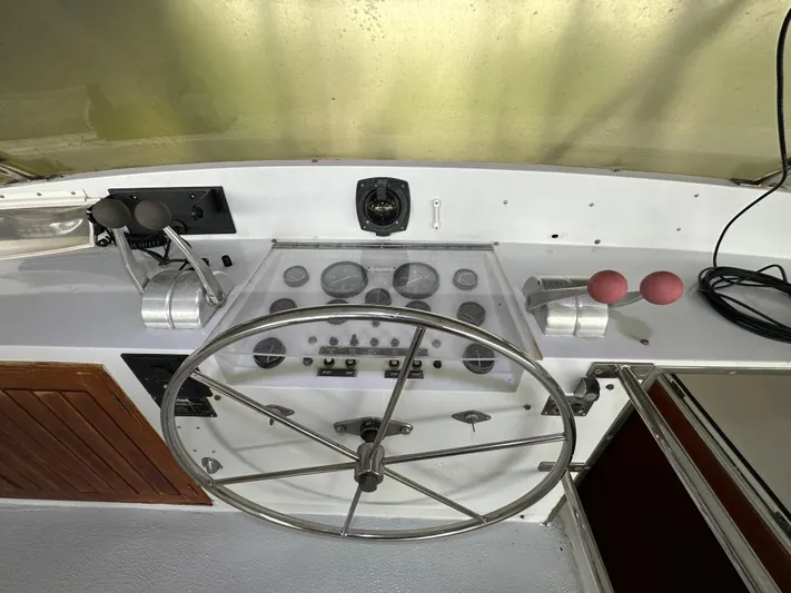 Ranger Yacht Photos Pics 1986 Cheoy Lee 66 Long Range Motor Yacht helm with steering wheel and controls.