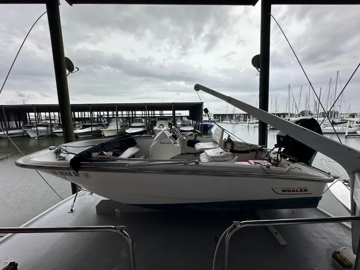 Ranger Yacht Photos Pics 1986 Cheoy Lee 66 Long Range Motor Yacht in marina, overcast sky, docked boats in background.
