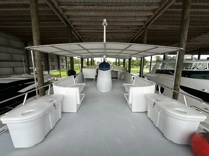 Ranger Yacht Photos Pics 1986 Cheoy Lee 66 Long Range Motor Yacht deck under cover, featuring spacious seating.