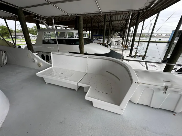 Ranger Yacht Photos Pics 1986 Cheoy Lee 66 Long Range Motor Yacht deck with seating area in marina.