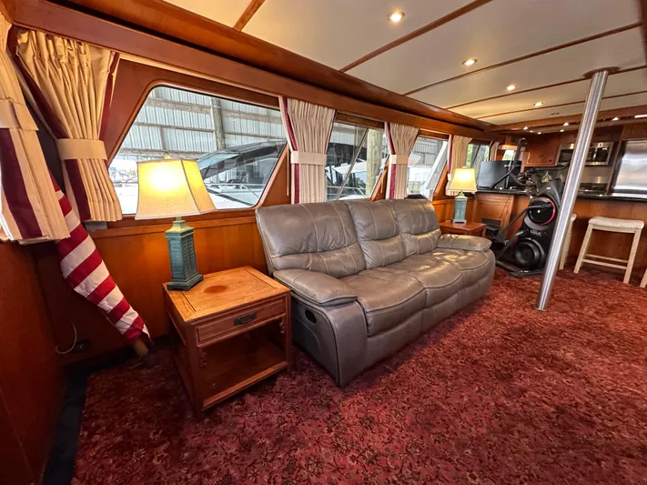 Ranger Yacht Photos Pics Interior of 1986 Cheoy Lee 66 Long Range Motor Yacht with leather sofa and elegant decor.
