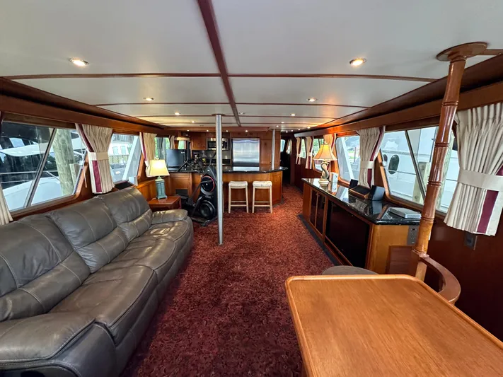 Ranger Yacht Photos Pics Luxurious interior of 1986 Cheoy Lee 66 Long Range Motor Yacht with plush seating and elegant decor.