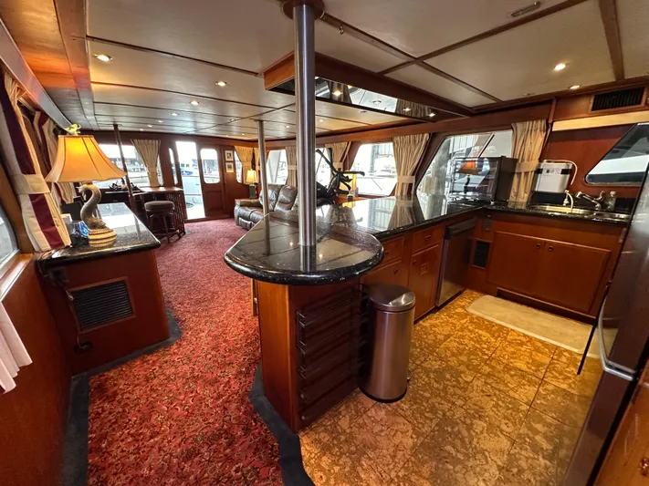 Ranger Yacht Photos Pics Interior of 1986 Cheoy Lee 66 Long Range Motor Yacht, featuring elegant wood finishes and spacious layout.