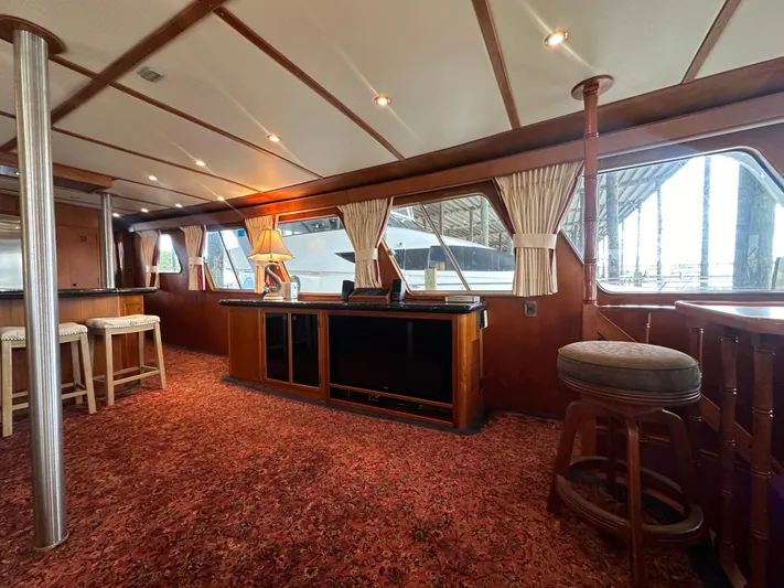 Ranger Yacht Photos Pics Interior of 1986 Cheoy Lee 66 Long Range Motor Yacht with elegant wood finish and seating.