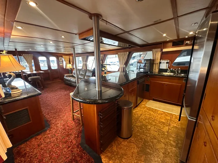Ranger Yacht Photos Pics Luxurious interior of 1986 Cheoy Lee 66 Long Range Motor Yacht with elegant wood finishes.