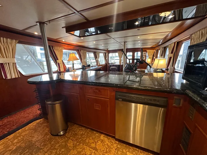 Ranger Yacht Photos Pics Luxurious interior of 1986 Cheoy Lee 66 Long Range Motor Yacht with elegant wood finishes.