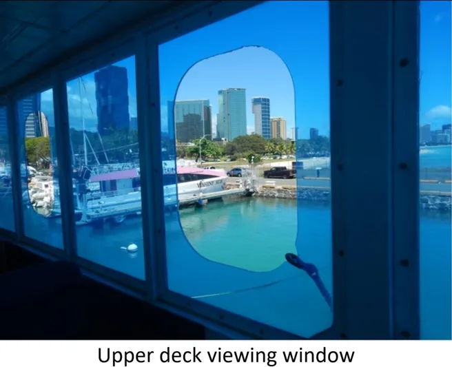  Yacht Photos Pics Upper deck view from 2010 Custom Semi Sub Power Catamaran, showcasing city skyline and harbor.