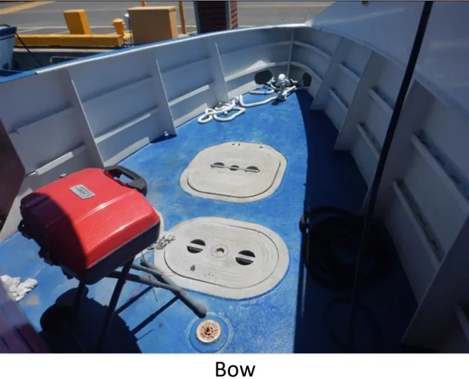  Yacht Photos Pics Bow of 2010 Custom Semi Sub Power Catamaran with blue deck and equipment.