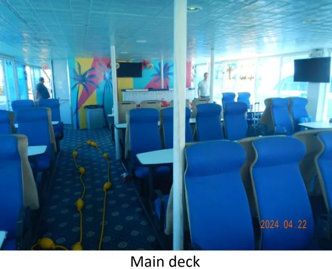  Yacht Photos Pics Main deck of 2010 Custom Semi Sub Power Catamaran with blue seating and vibrant decor.