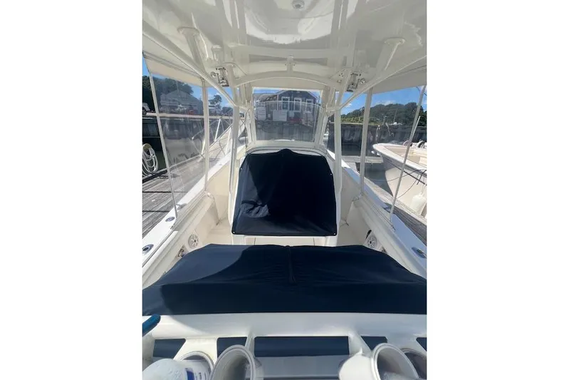 Tesoro Mio Yacht Photos Pics 2017 Regulator 31 boat interior with covered seating and clear windows.