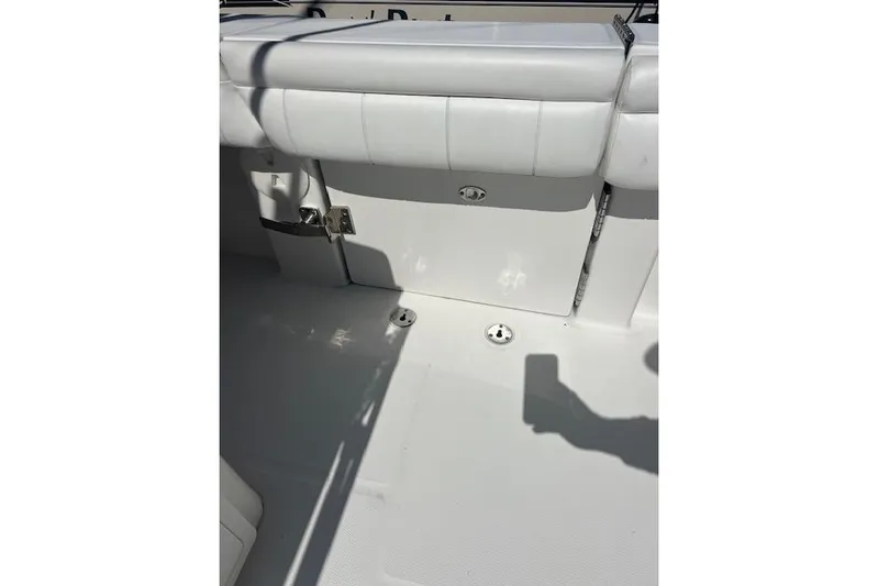 Tesoro Mio Yacht Photos Pics 2017 Regulator 31 boat interior with white seating and deck details.