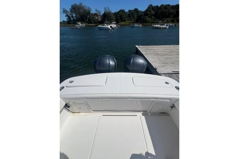 Tesoro Mio Yacht Photos Pics 2017 Regulator 31 boat with dual engines docked on a sunny day.